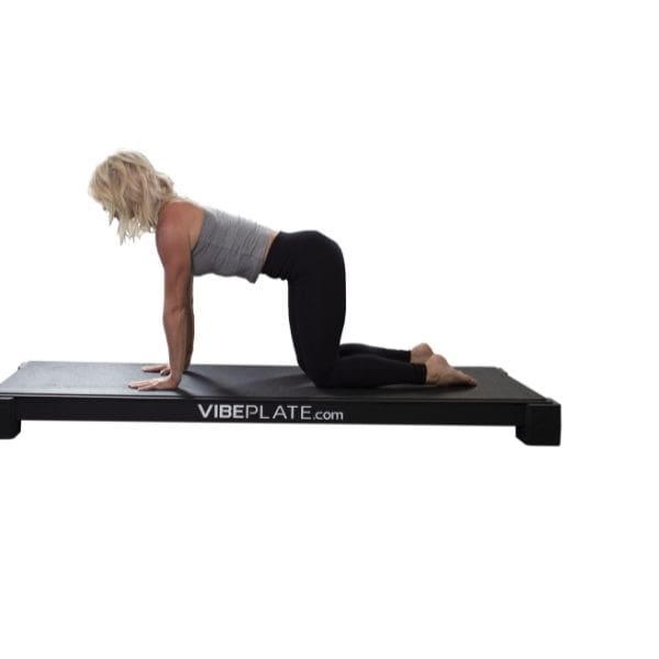 VibePlate Yoga Plate Kneeling While Hands Touching Yoga Plate