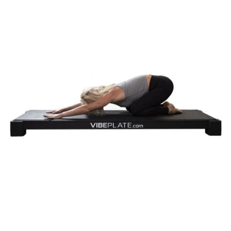 VibePlate Yoga Plate Kneeling While Hands Touching Yoga Plate Low
