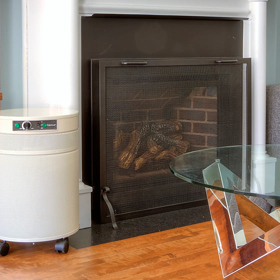 Air Purifier in a living room by a fireplace