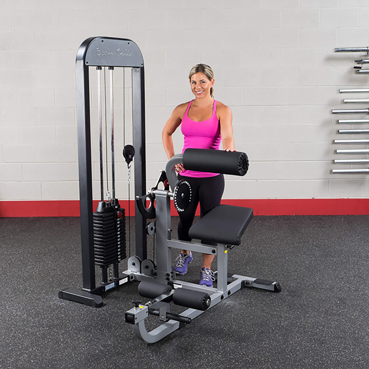body solid gcab stk pro select ab and back machine woman behind machine