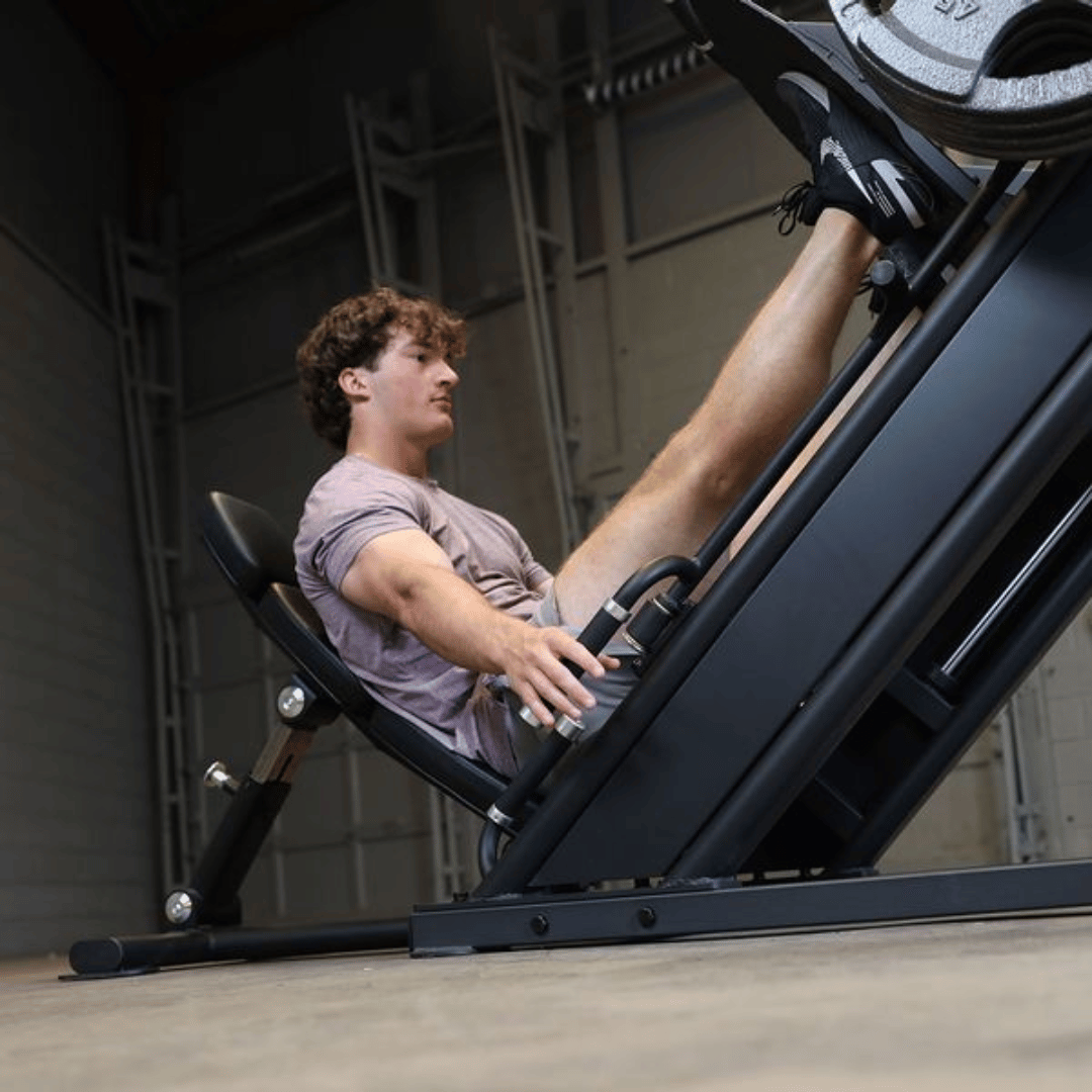 body solid sglp500 pro clubline commercial leg press male closeup