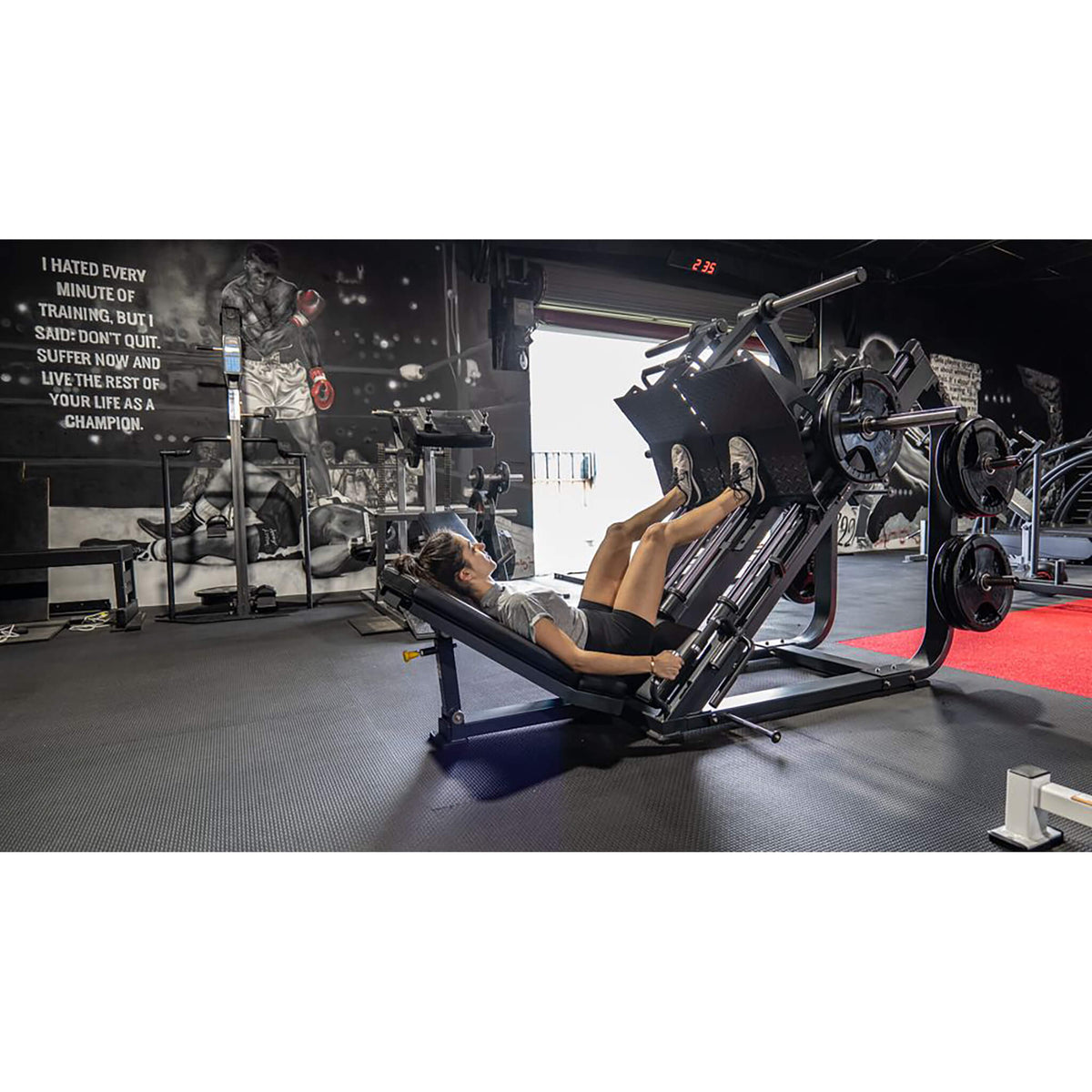 bodykore fl1801 leg press woman exercising