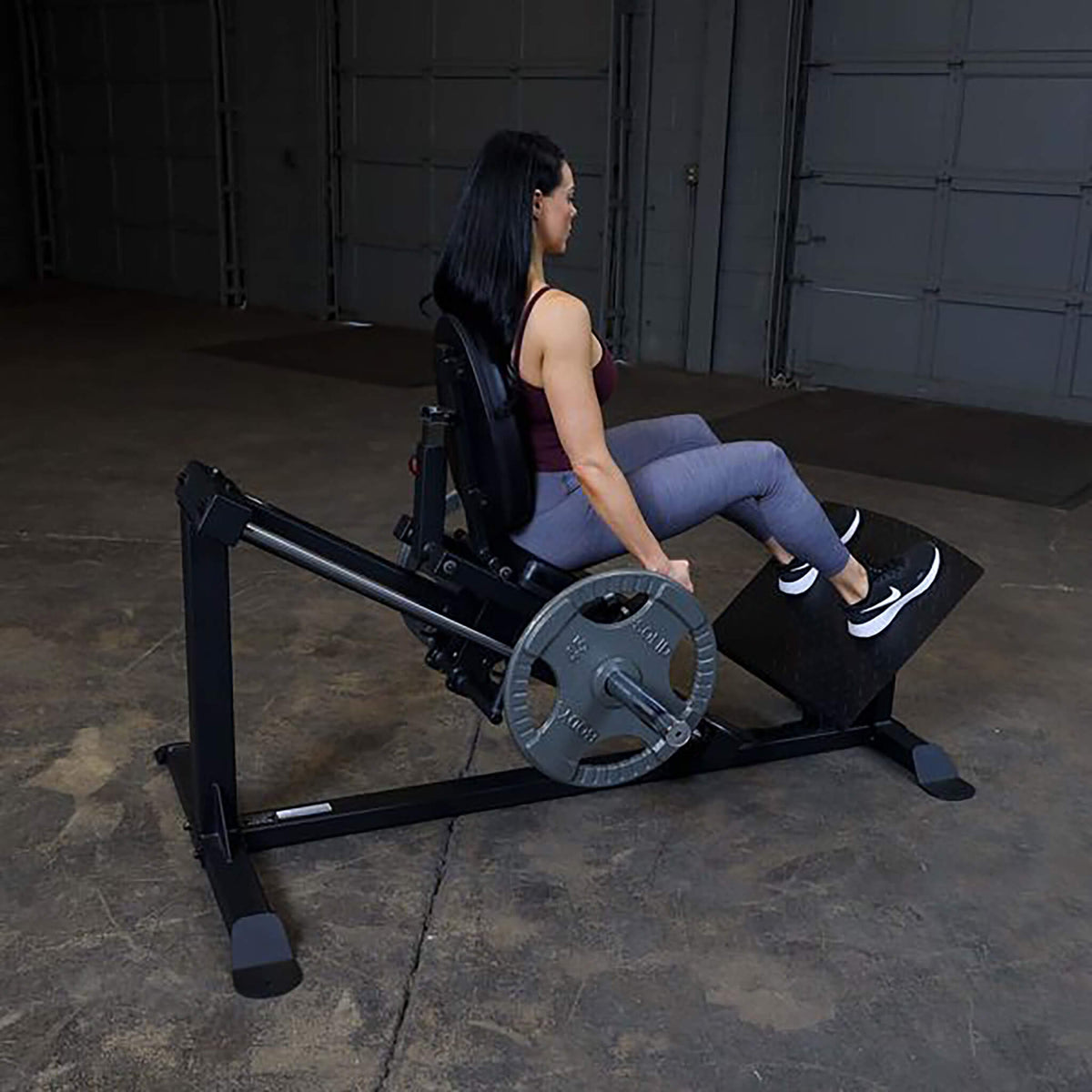 compact leg press gclp100 woman back view