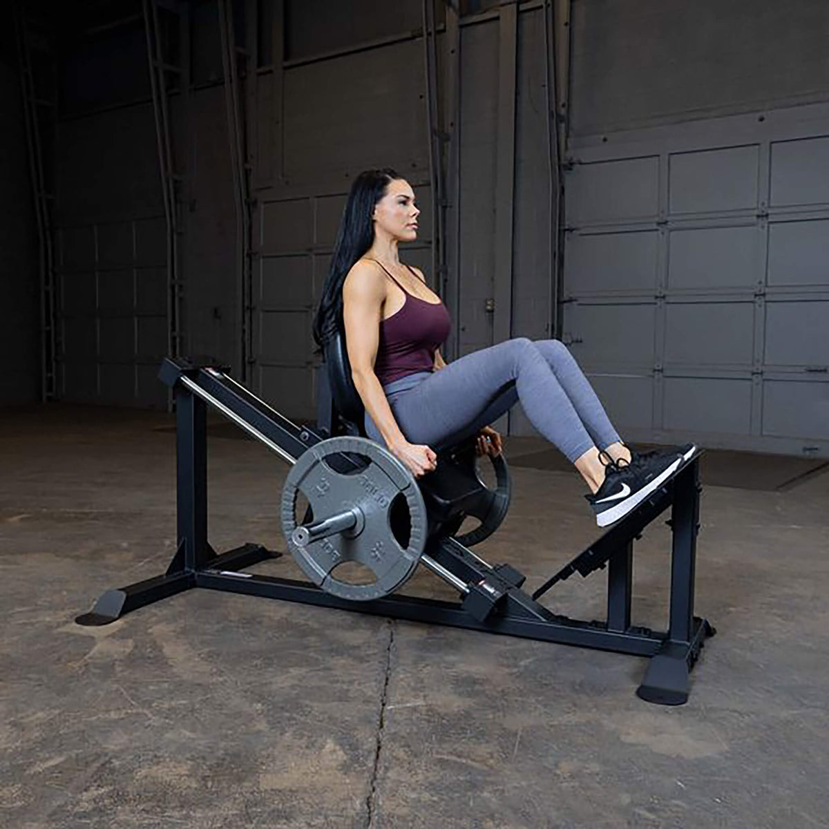 compact leg press gclp100 woman side view