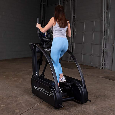premium elliptical trainer e5000 woman exercise back side view