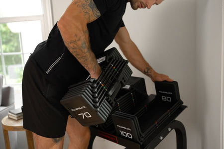 Powerblock pro 100 EXP Lifestyle Photo With Man Racking