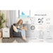 EnviroKlenz Air System Plus in Home with Woman on the couch showing the air purifier is effective against viruses, pollen, bacteria, mold, smoke, VOCs, cooking odors, pet dander, formaldehyde, and more!